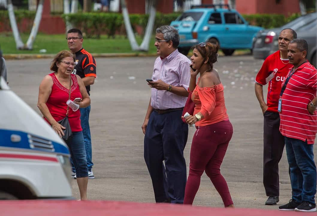 Distraught relatives of passengers aboard Boeing 737 await news of their loved ones.