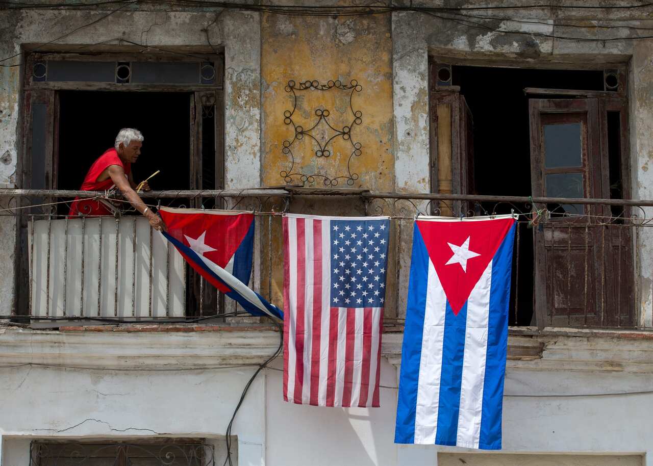 A house displays the flags of the United States and Cuba, in Havana