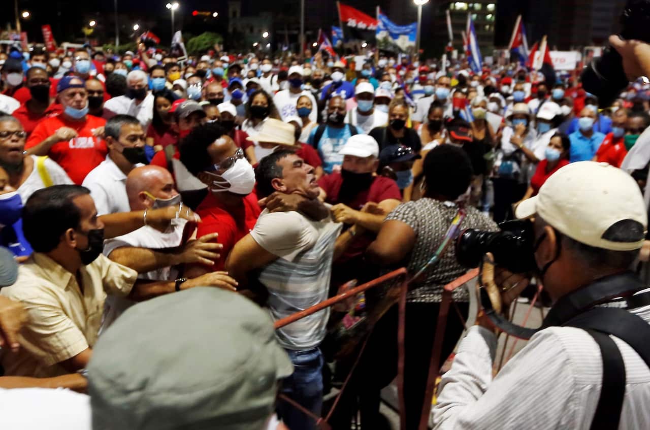 A man is arrested during an event in support for the revolution in Havana, Cuba on 17 July 2021. 