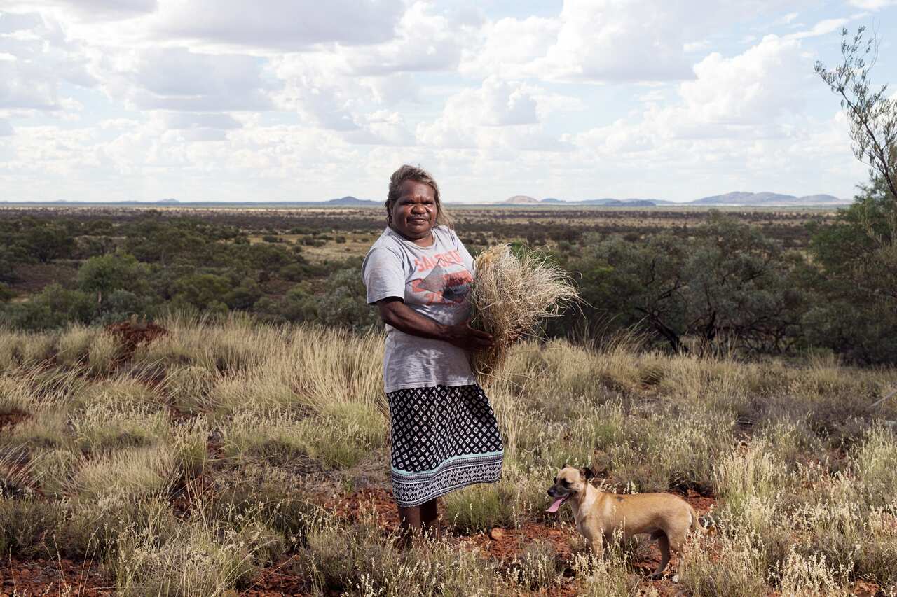 Cynthia Burke from Warakurna, WA, collecting materials for weaving.