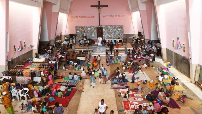 Women and children shelter inside a Roman Catholic Church in Pemba after Cyclone Kenneth 