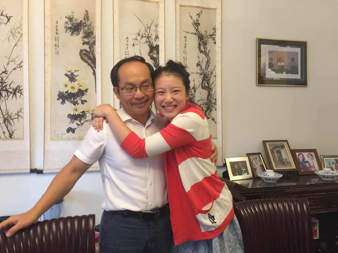 Dr Feng Chongyi reunites with his daughter after being detained in China. 