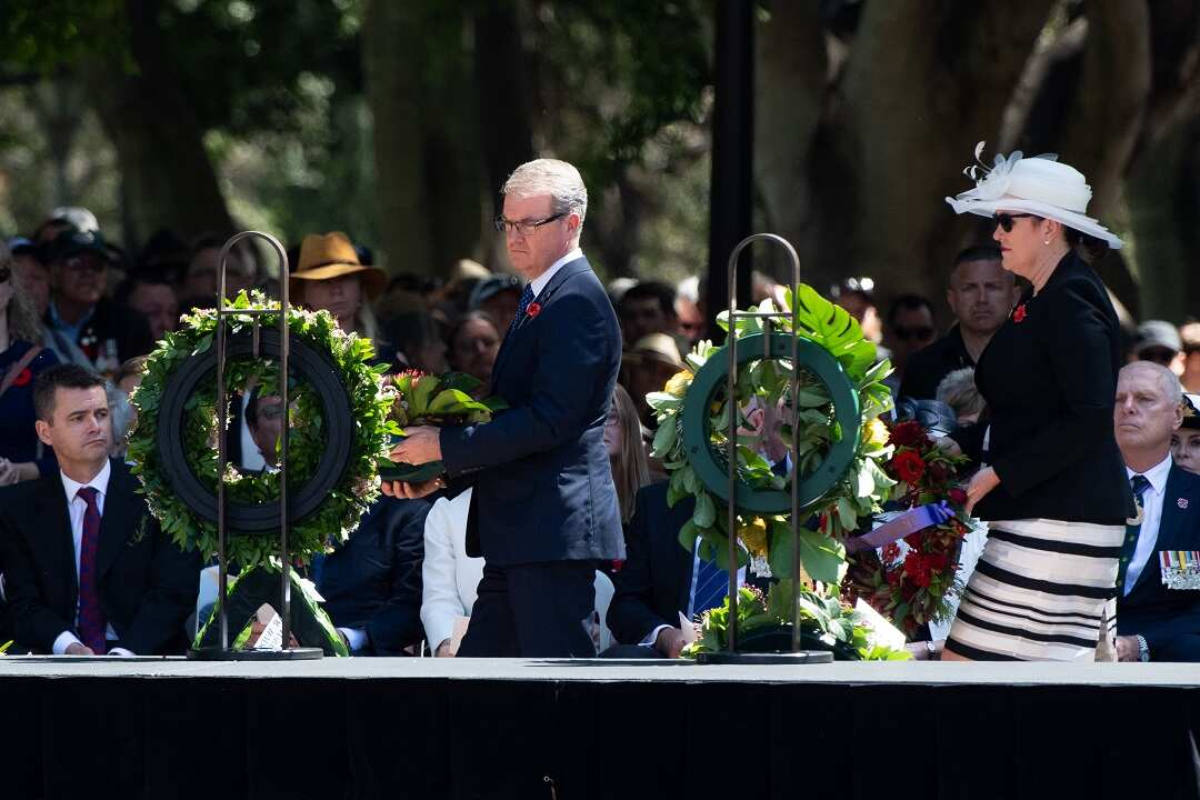 NSW Opposition leader Michael Daley (left) lays a wreath by the Pool of Reflection during Remembrance Day in Sydney.