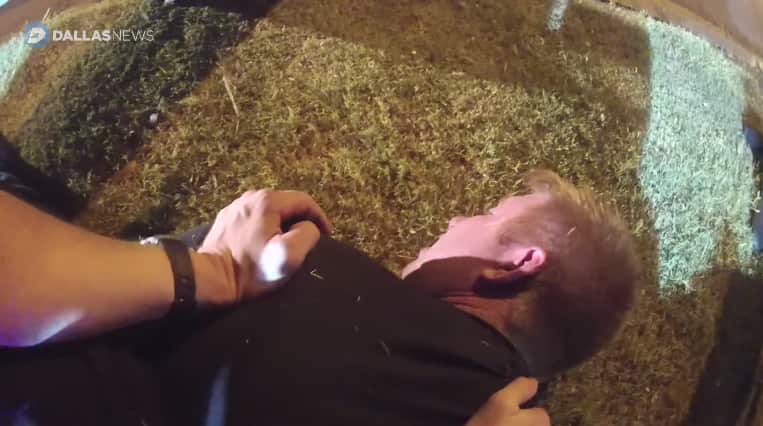 Tony Timpa is restrained by three Dallas police officers.