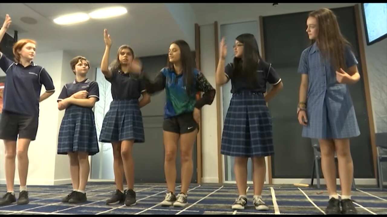 Tamia leads a workshop with the students.