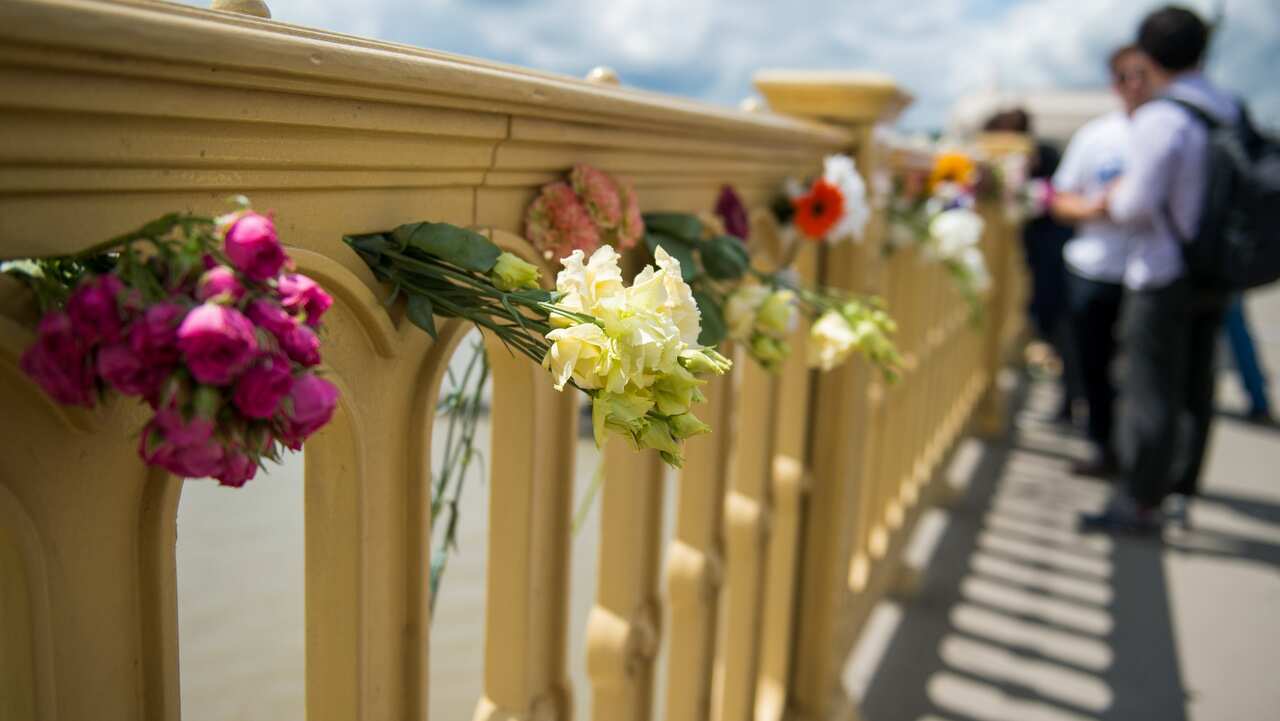  Flowers are left in memory of the victims on the Margaret Bridge, the site of the boat accident in Budapest.