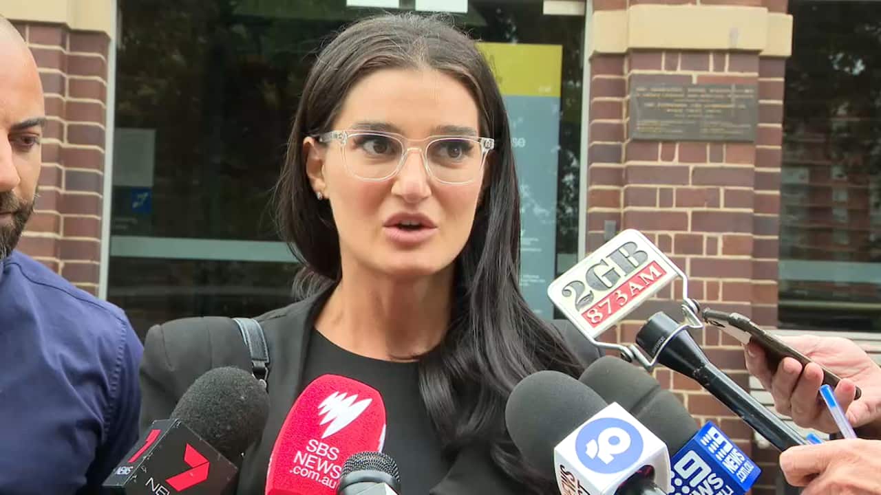 Ayda Celine speaking outside court. 