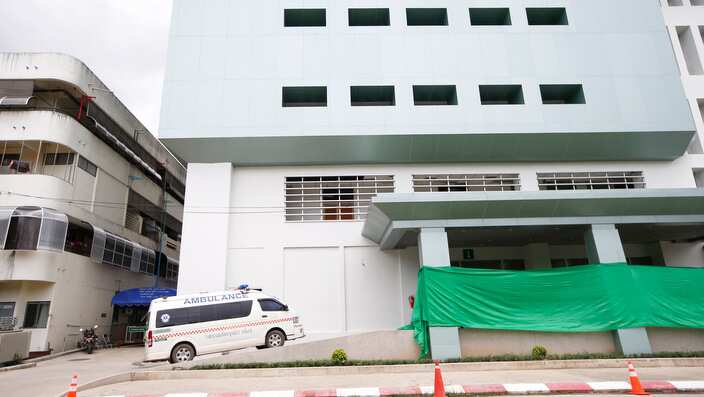 A green tarpaulin is used to cover the entrance of the Chiangrai Prachanukroh Hospital, where the four rescued boys are being kept in quarantine. 