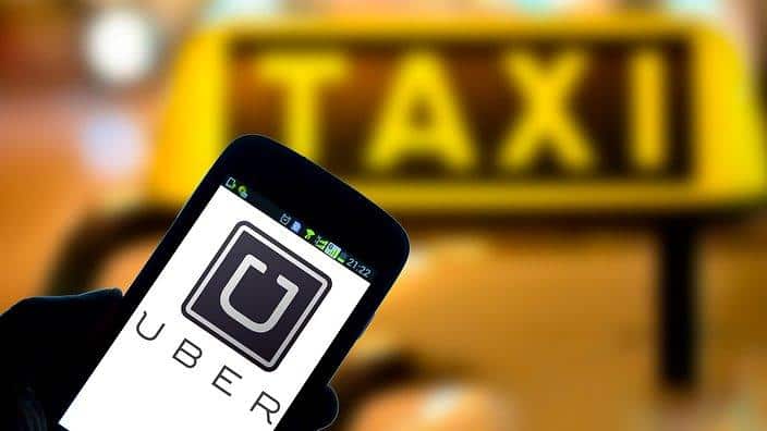 Thousands of taxi and hire car drivers have joined a class action against Uber alleging the rideshare company operates illegally in Australia.