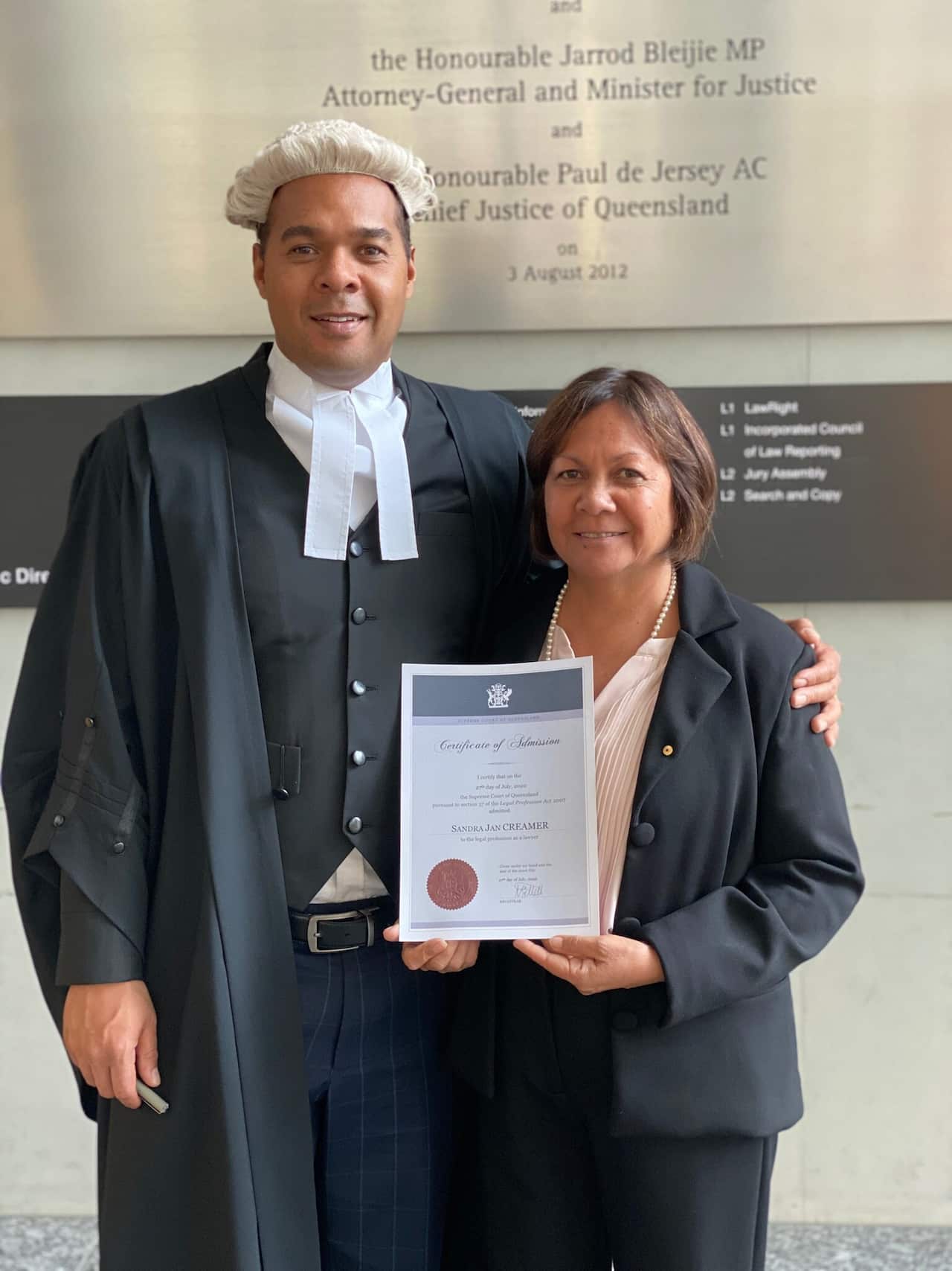 Barrister at Law, Joshua Creamer stands next to his mother Sandra Creamer after admitting her to the Queensland Supreme Court on Monday, 27 July. 