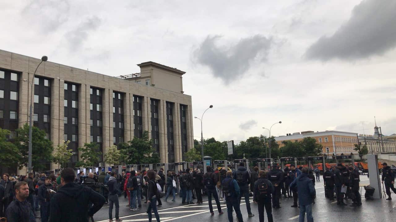 Police set up body scanners and frisking stations at the protest
