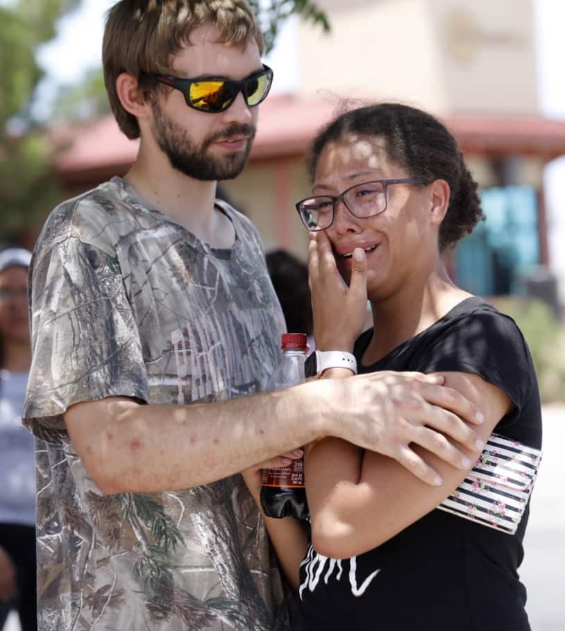 Kendall Long (L) comforts Kianna Long (R) who was in the freezer section of a Walmart during a shooting incident, in El Paso, Texas, USA, 03 August 2019.
