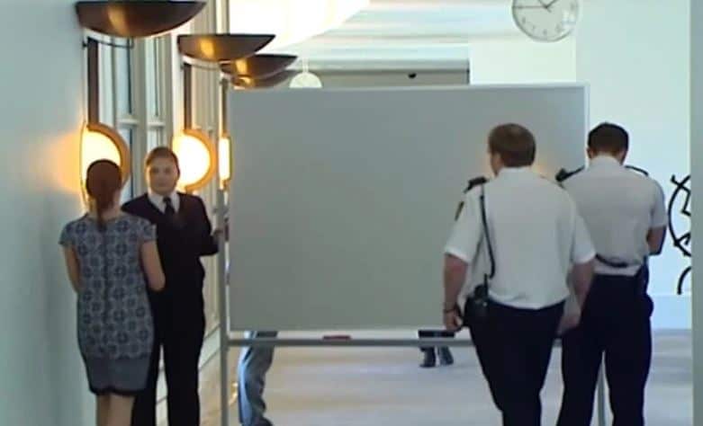 Michaelia Cash uses whiteboard to shield herself from media.