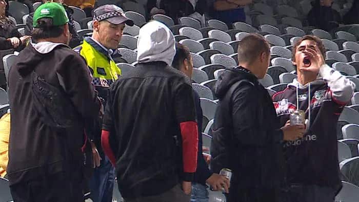 The group of spectators ejected from the crowd for alleged racist abuse.