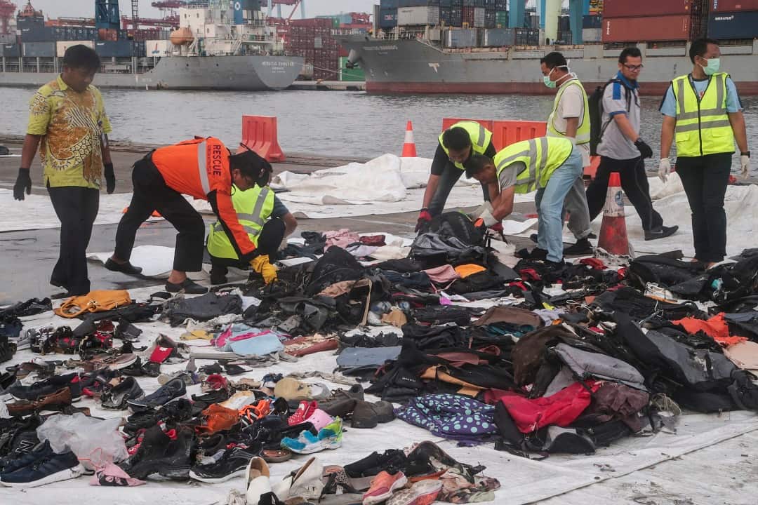Piles of passengers' belongings has been recovered from the water.