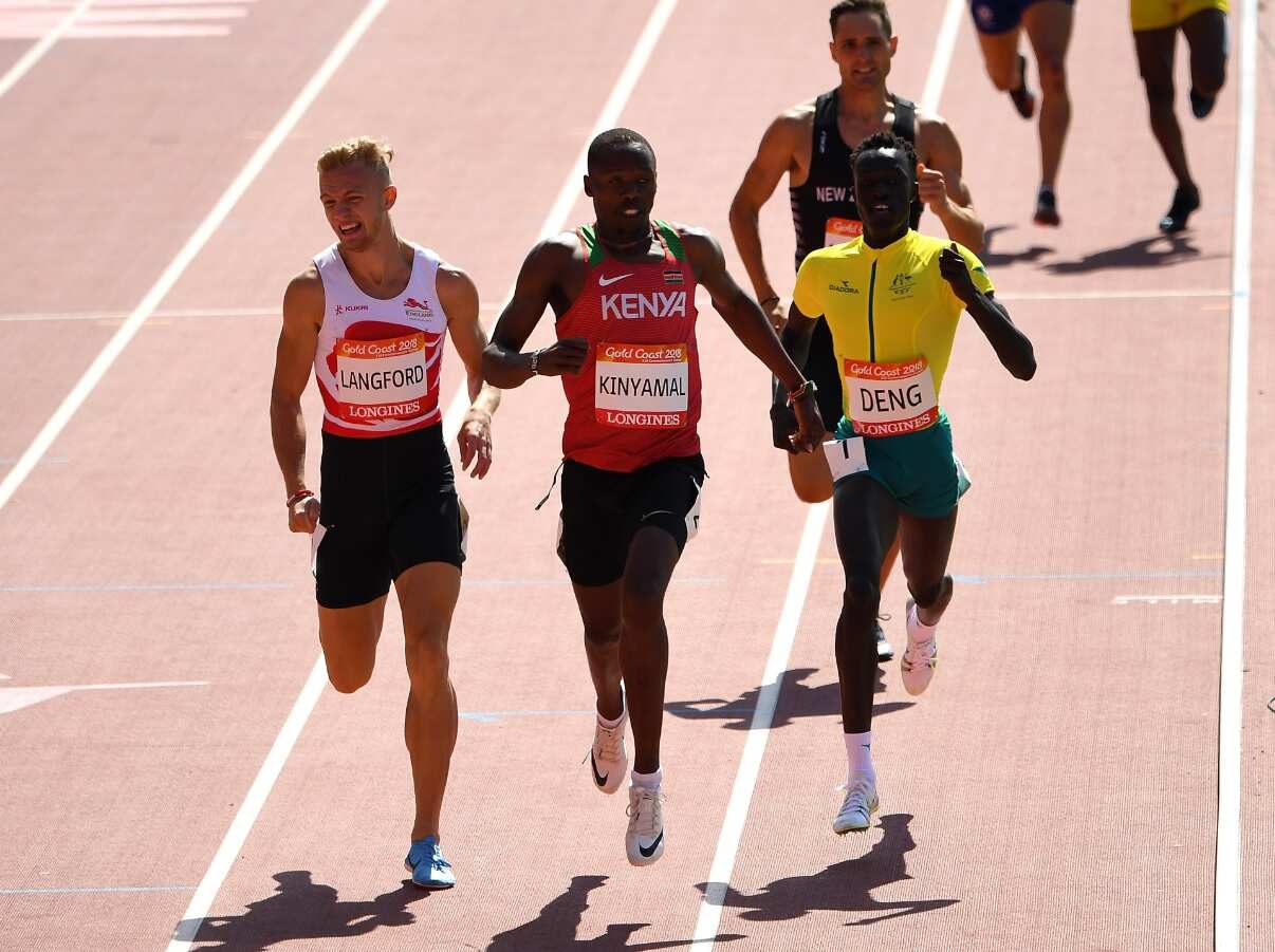 Joseph Deng (R) of Australia running for Australia at the Commonwealth Games. 