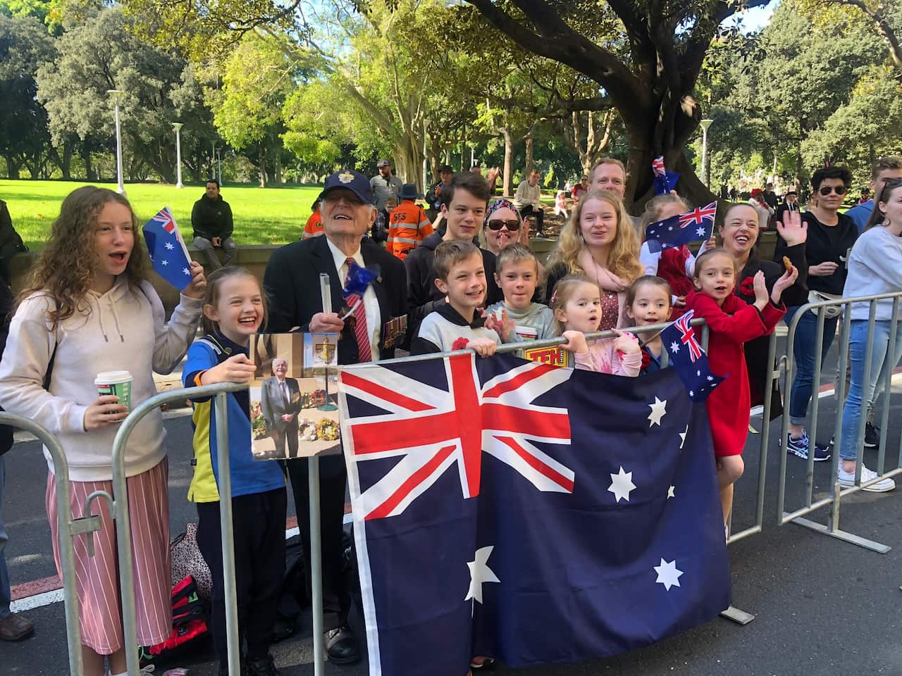Dennis Davis and his family attend the Sydney Anzac Day parade. 