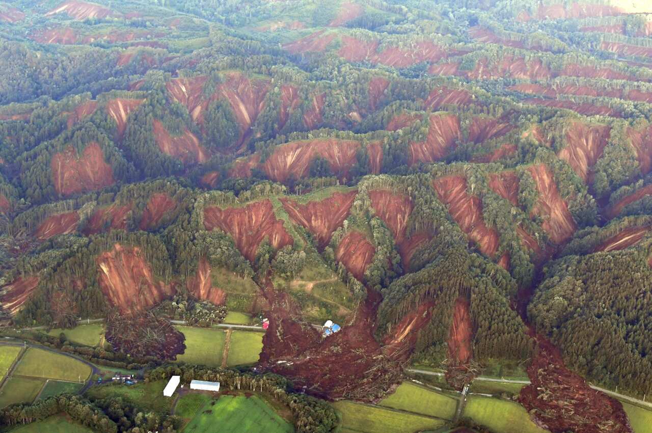 An aerial photo shows landslides that seem to be happened by the earthquake in Atsuma Town, Hokkaido on Sep.6, 2018. 