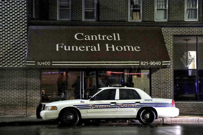 A Detroit Police vehicle parked outside the Cantrell Funeral Home in Detroit. Several cremated remains were n found by cleaning crews in a separate case.