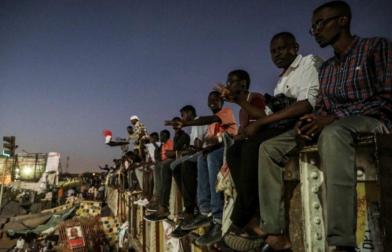 Sudanese protesters chant slogans during a rally outside the army headquarters in Sudan's capital Khartoum on Saturday, April 20, 2019.