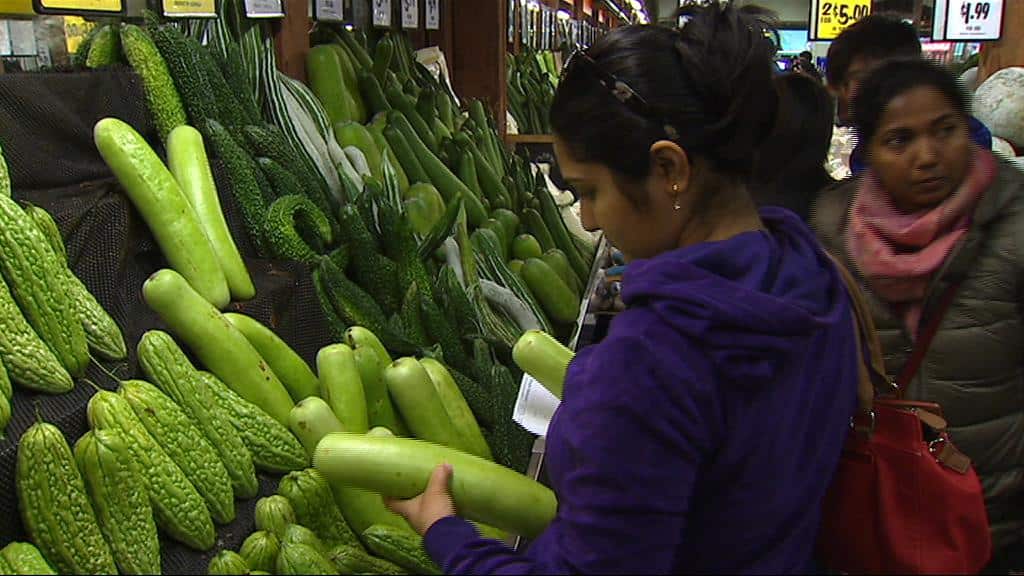 Customer's browsing the varied produce at Clayton's Fresh Fruit Mart.