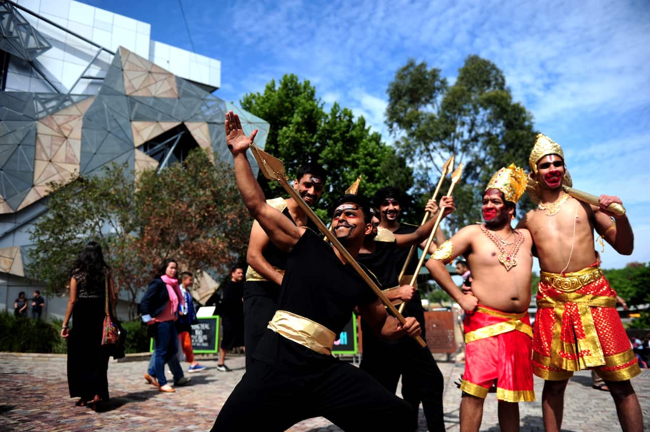 Performers pose for photograhs during Diwali celebrations at Federation Square in Melbourne.