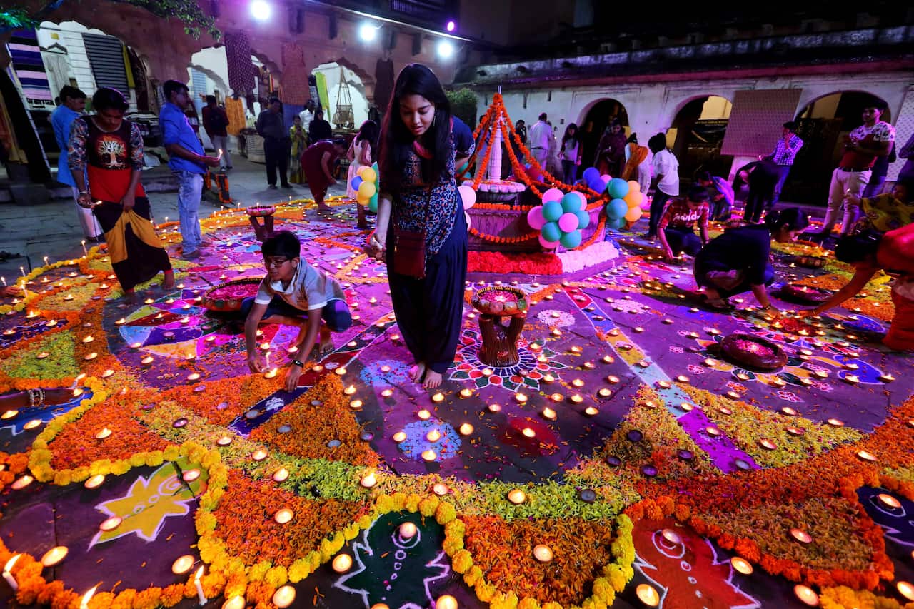 Indian people light oil lamps during the Light Festival as part of the Diwali festival celebrations in Bhopal, India.