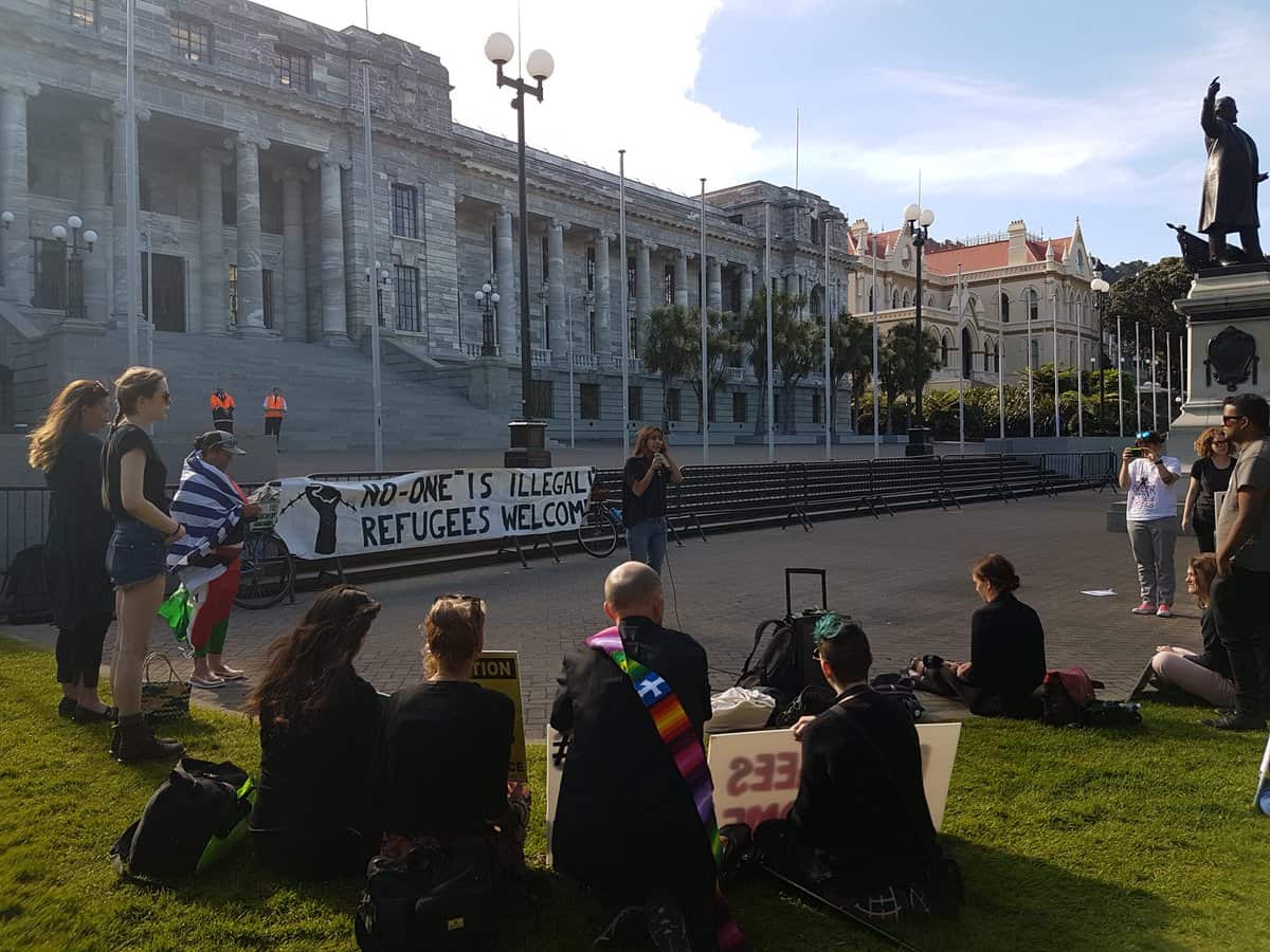 Protesters tell stage a vigil outside New Zealand Parliament House in support of refugees on Manus Island.