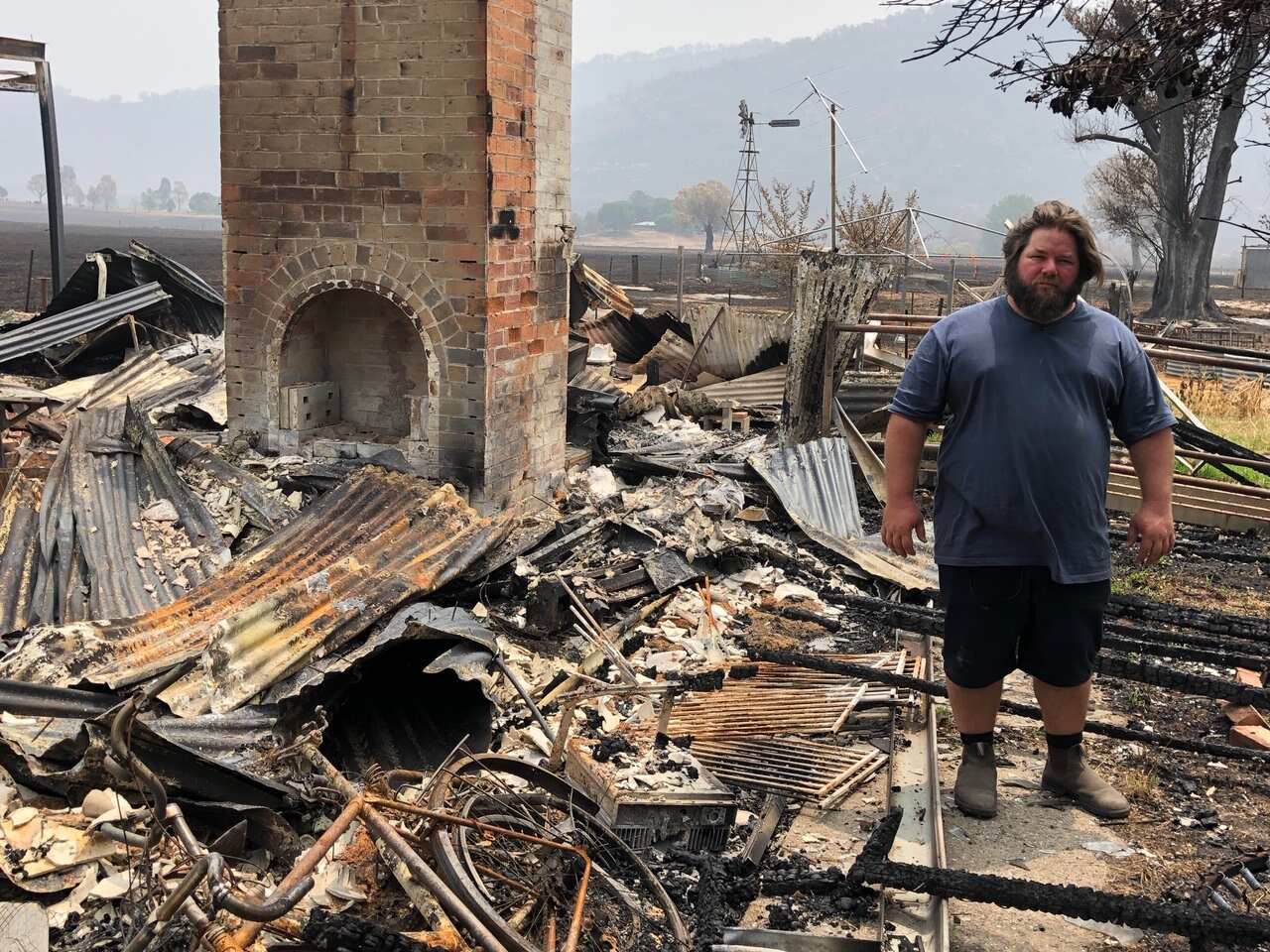 Joshua Collings and his house. He's vowing to rebuild and has already started fund raising. 
