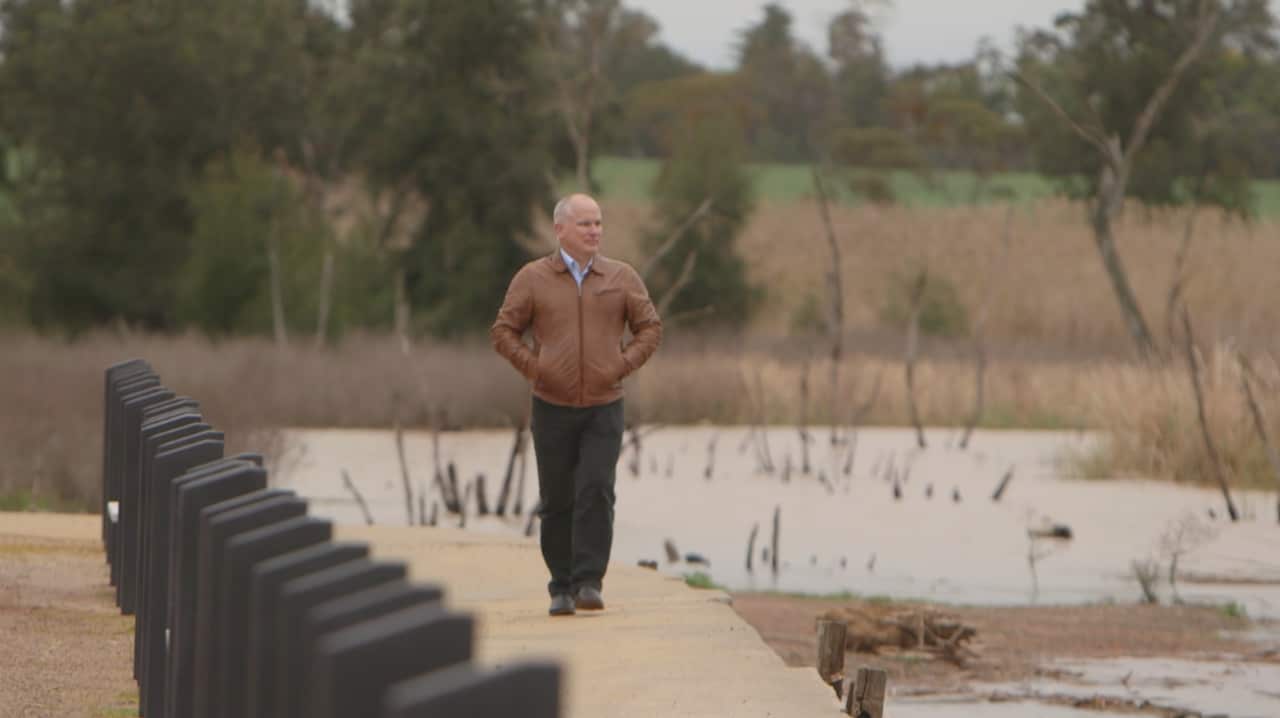 Looking for answers ... Professor Dominic Rowe at Lake Wayangan, which was closed for recreation last summer.
