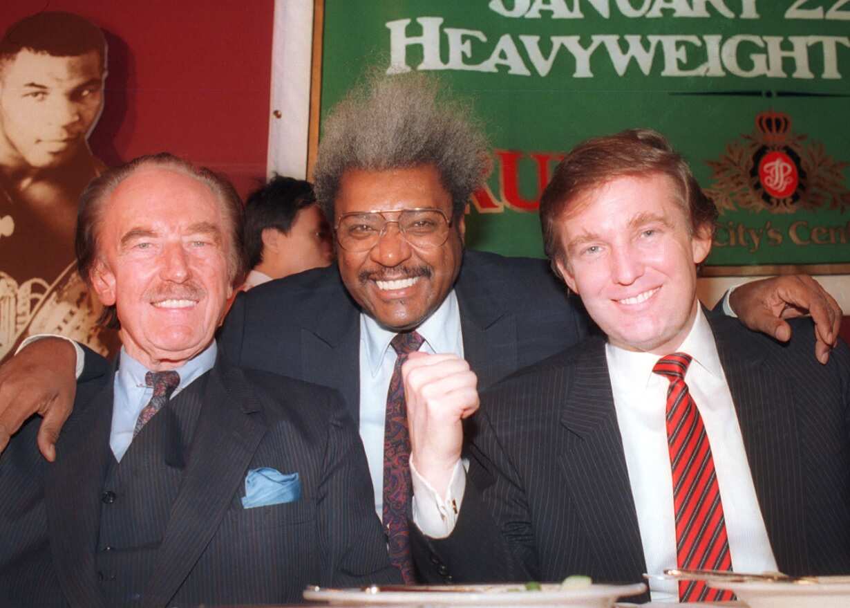 Dec. 1987 file photo, Donald Trump, right, pictured with his father, Fred Trump, left, and boxing promoter Don King