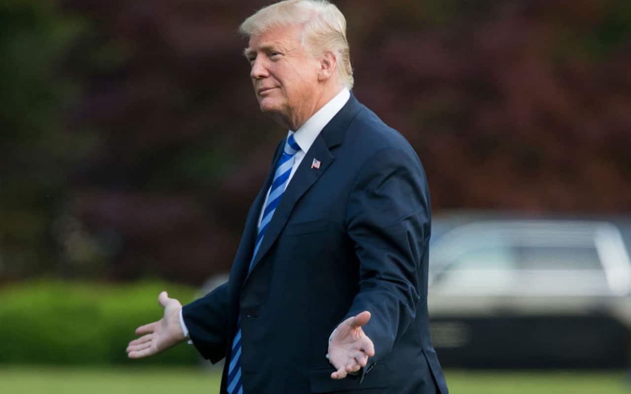 US President Donald Trump walks on the South Lawn of the White House.