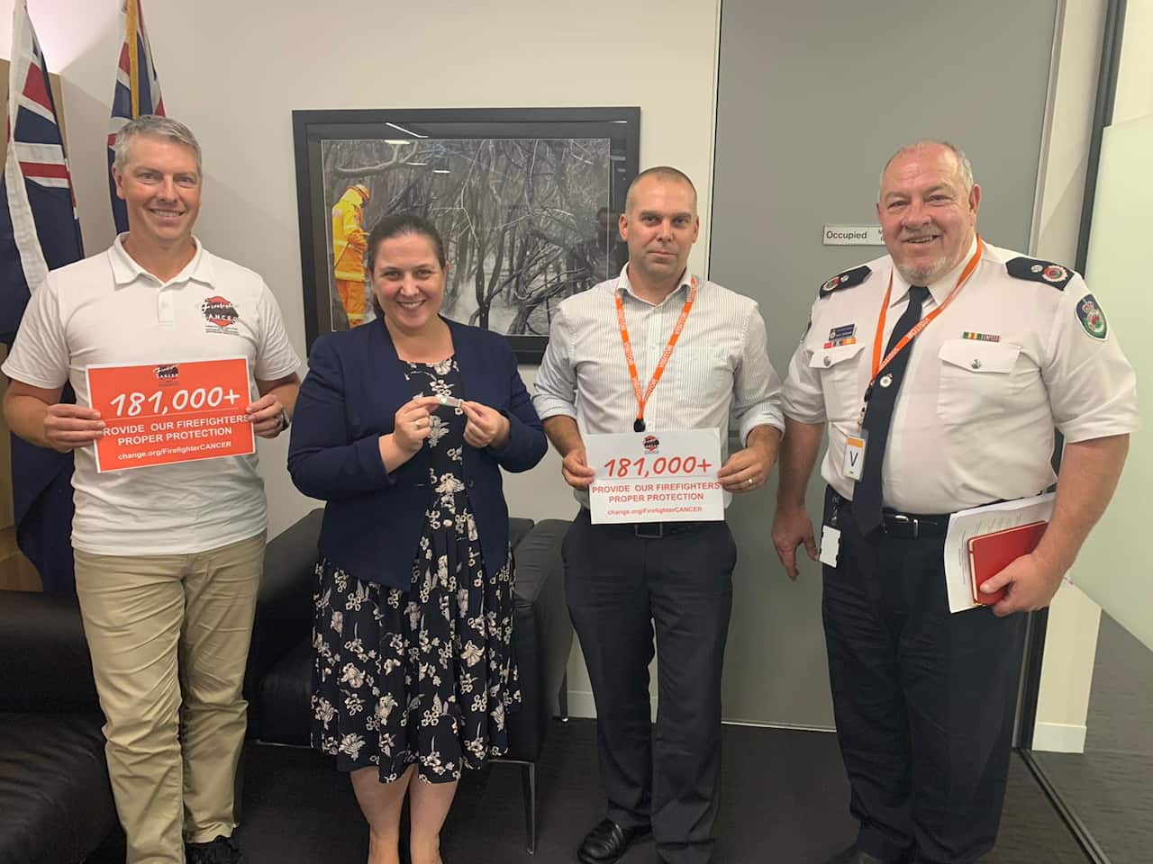 Brett Carle, state Liberal MP Melanie Gibbons, Ryan Cleggett from Firefighter CANCER and NSW RFS Senior Assistant Commissioner Bruce McDonald with the petition.