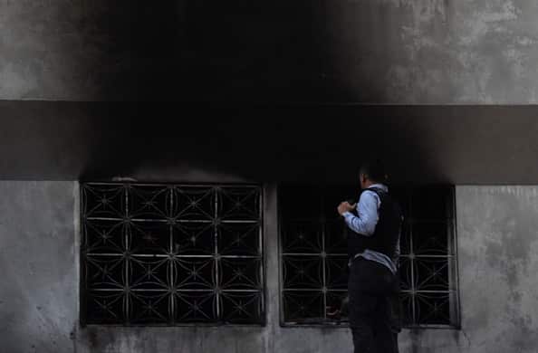 Security forces check a building after an explosion was heard while Venezuelan President Nicolas Maduro was attending a ceremony.