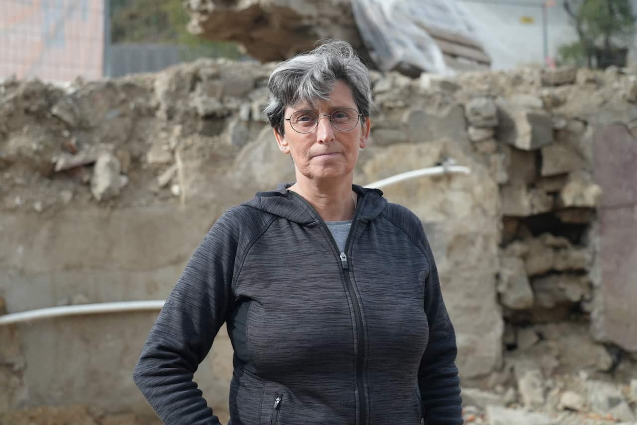 Cornelia Schlosser stands in what was once the basement of her family's bakery in Schuld. 