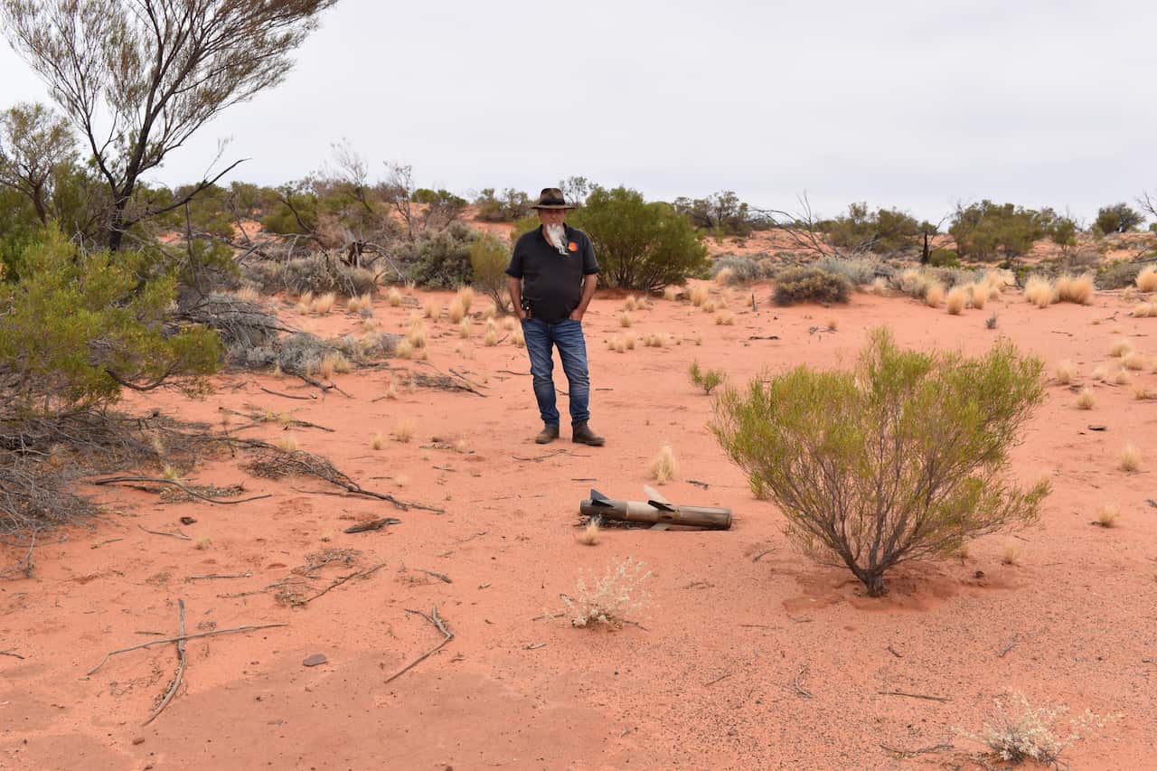 Kokatha man Andrew Starkey stands near the missile before it was retrieved from the site. 