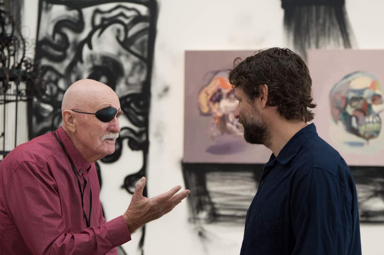 Ben Quilty chats at media preview of 'Quilty'.