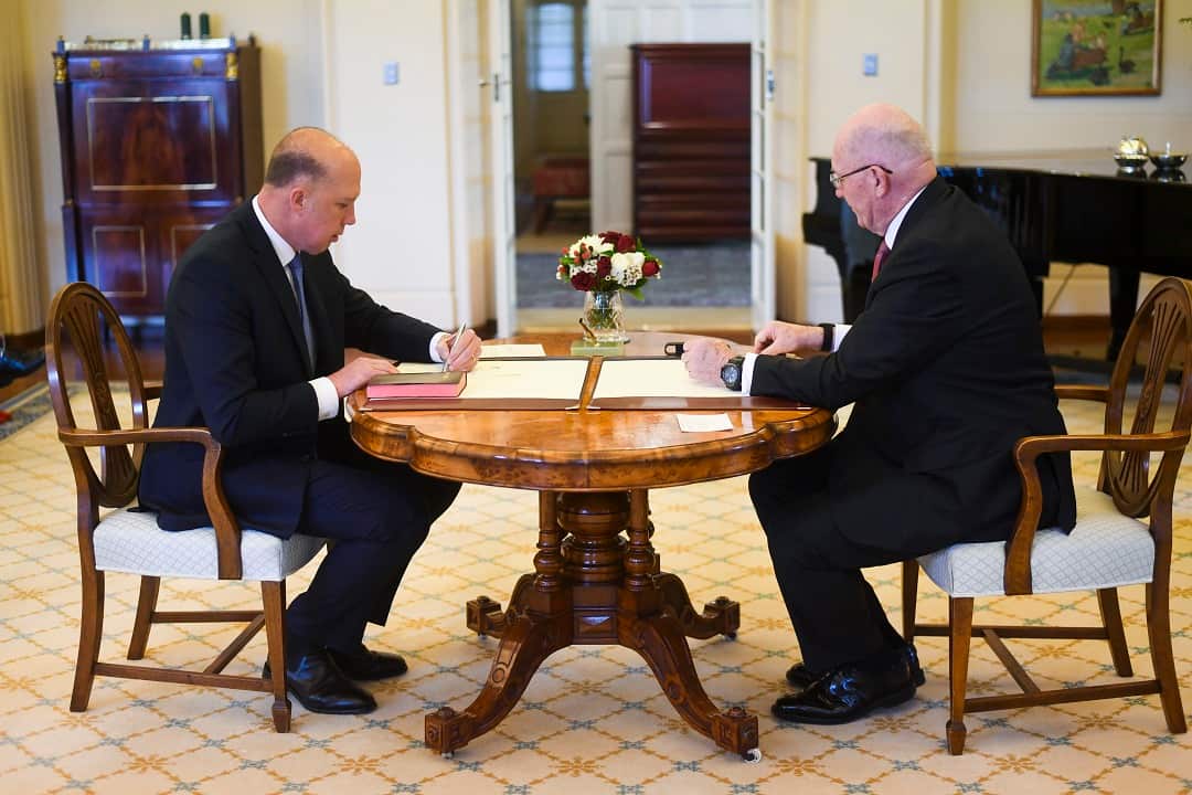 Liberal MP Peter Dutton (left) is sworn in as Home Affairs Minister by Australian Governor-General Sir Peter Cosgrove during a ceremony at Government House in Canberra, Monday, August 27, 2018.  (AAP Image/Lukas Coch) NO ARCHIVING