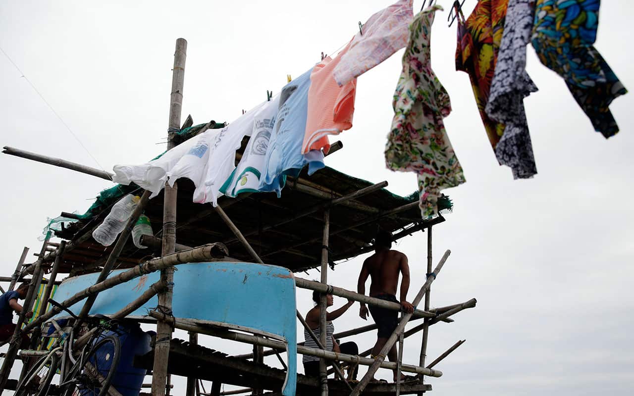A Filipino resident releases a dove at a coastal village in Cavite city, Cavite province, Philippines.