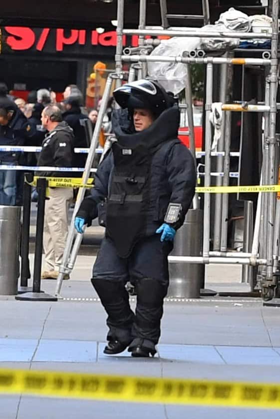 A NYPD bomb squad technician outside CNN's New York office after a pipe bomb was mailed to the broadcaster.