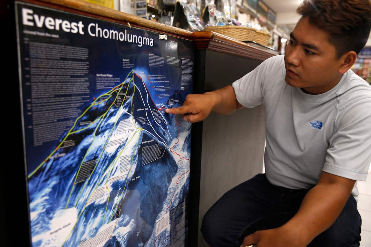 Nepalese Pemba Sherpa, Operation Manager of Seven Summit Treks, shows the spot on a map where an Australian woman died (AAP)