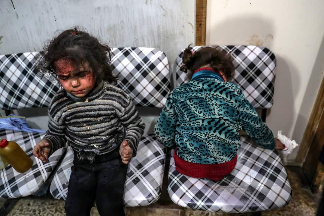 Injured children receive medical attention inside a hospital after bombing, rebels-held Douma, Eastern Ghouta, on 22 February 2018.