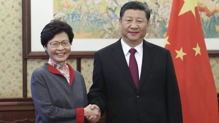 Chinese President Xi Jinping, right, meets with Hong Kong Chief Executive Carrie Lam in Beijing, Friday, Dec. 15, 2017.