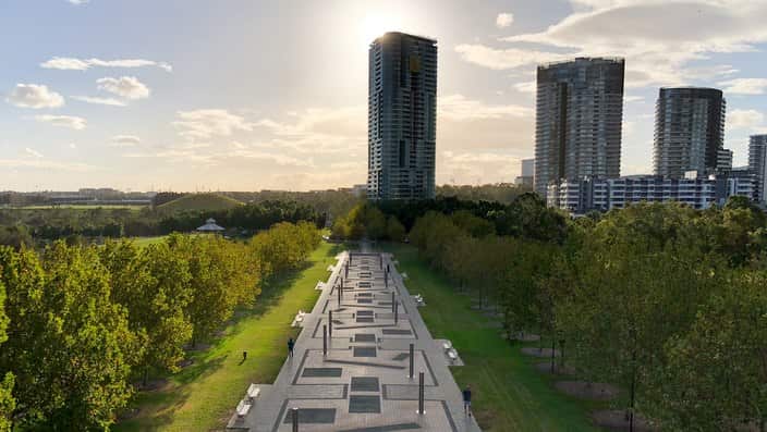 FILE - The Opal Tower is seen at Olympic Park in Sydney, Saturday, January 14, 2018. Emergency services are helping residents evacuating a 30-story high-rise building in Sydney amid fears the structure could collapse. (AAP Image/Paul Braven) NO ARCHIVING