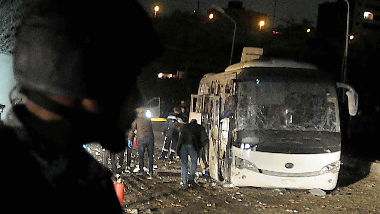 Security personnel inspect the scene of a bomb explosion, near Mariottia Corridor, Giza, Egypt, 28 December 2018.