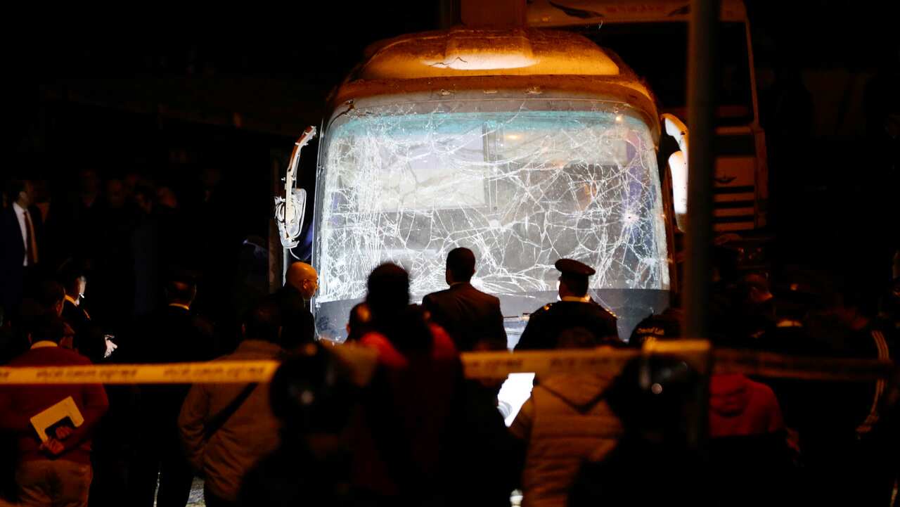 Security personnel inspect the scene of a bomb explosion, near Mariottia Corridor, Giza.