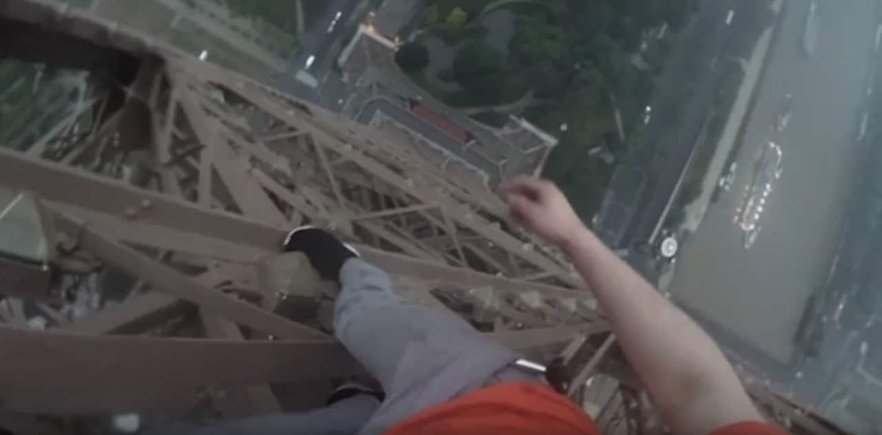 Russian men embark on a death defying climb up the Eiffel Tower.