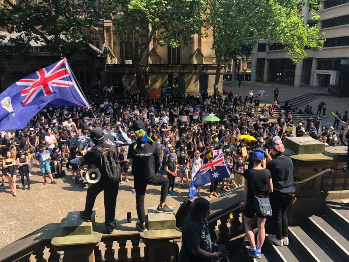 Pro-democracy groups rally in Sydney to condemn China's activity in Hong Kong.