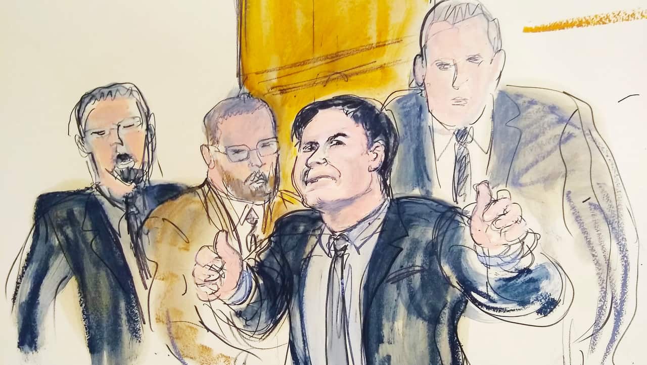 In this courtroom drawing, Joaquin "El Chapo" Guzman, second from right, accompanied by US Marshalls, gestures a "thumbs up" to his wife.