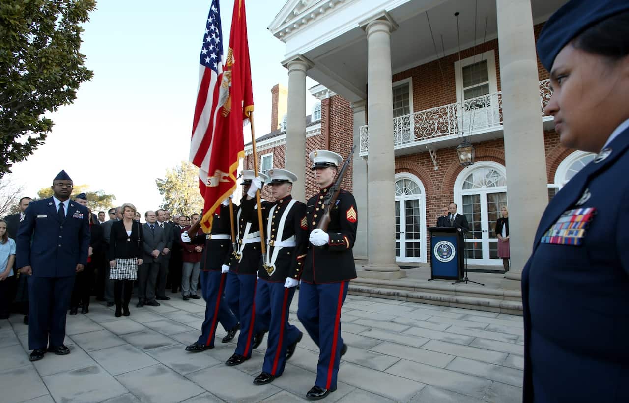 Marines post colours at the September 11 Remembrance Ceremony at the United States Embassy in Canberra (AAP)